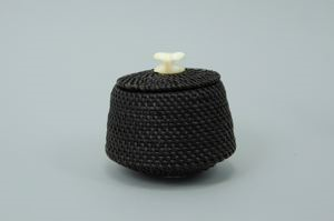 Image of baleen basket in tapered shape, with whale fluke finial